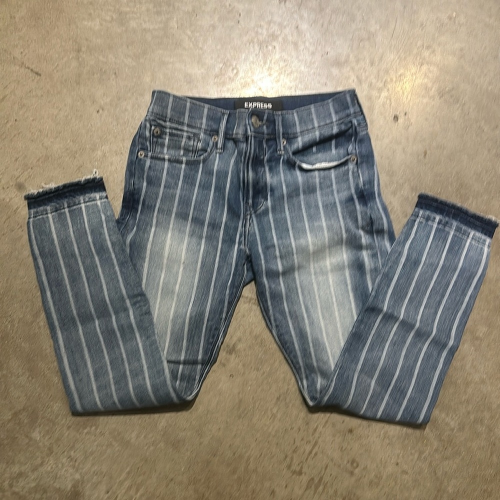 Express raw edge stripped skinny jeans